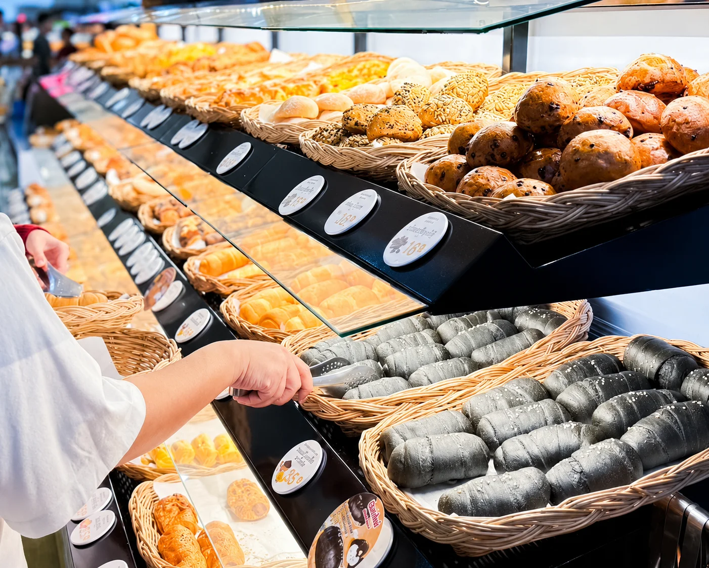 A Bonjour bakery display filled with freshly baked products