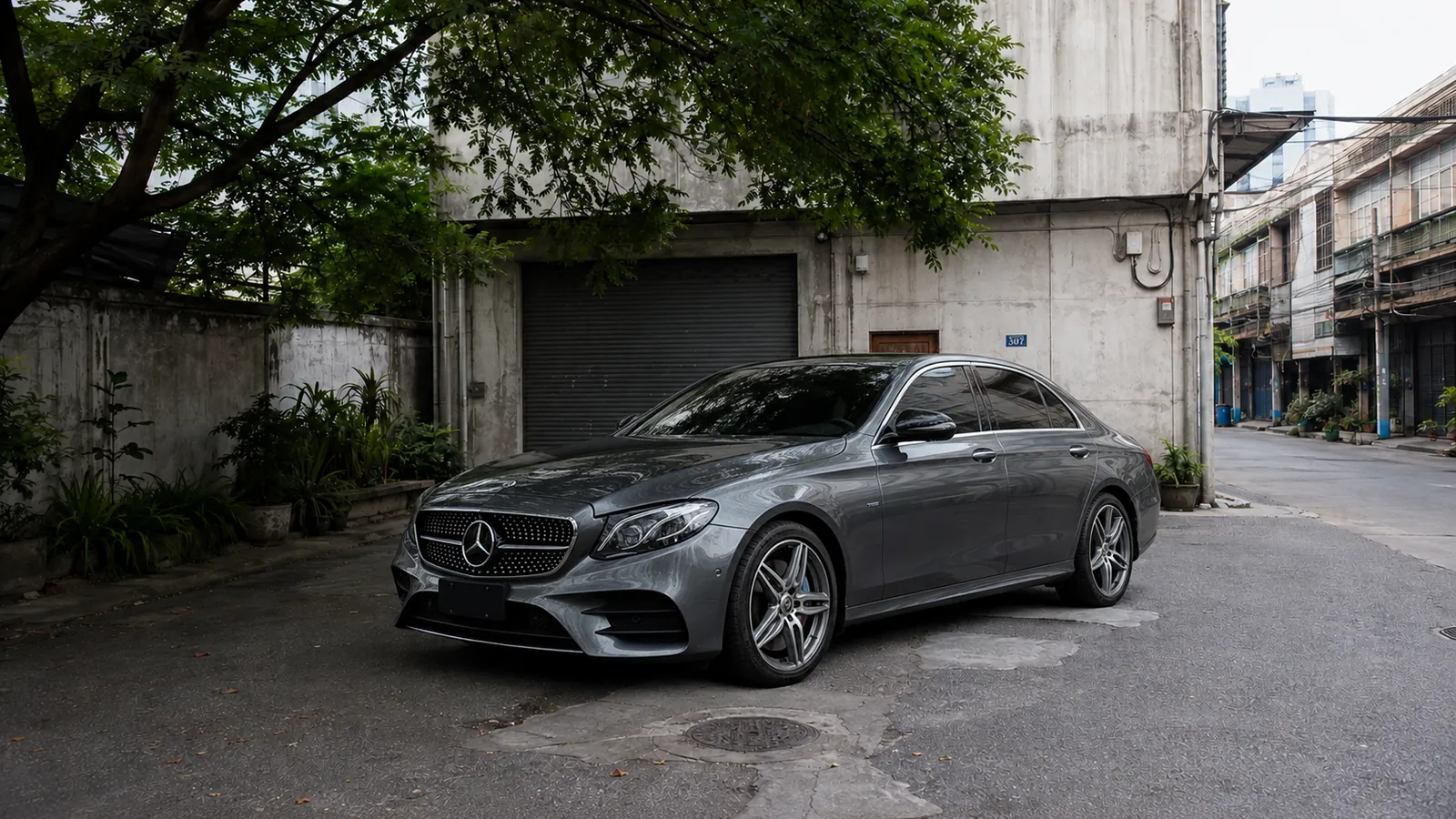 Mercedes E 350 e front three quarter in the Charoen Krung courtyard during daytime